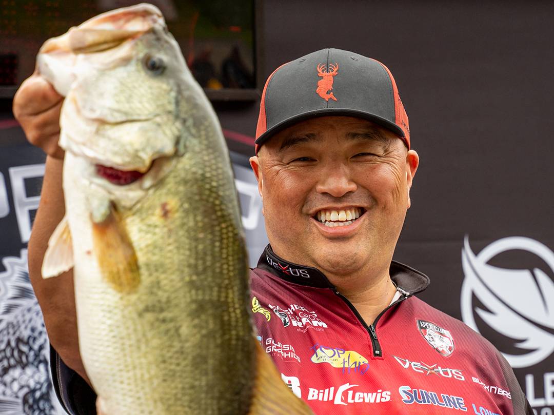 Ken Mah holding a fish